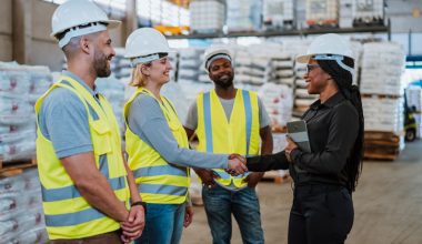 Work team in factory warehouse