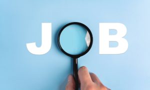 The word "JOB" with a magnifying glass over the "O" on a blue background.