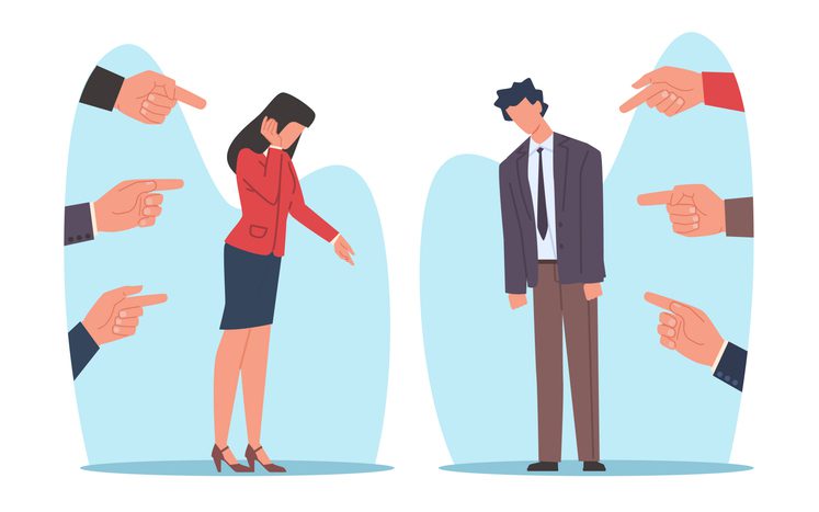 The image shows two individuals standing apart, each surrounded by multiple hands pointing fingers at them. The individual on the left is a person with long hair wearing a red blazer and a dark skirt, covering their face with one hand and lowering the other. The individual on the right is a person with short hair wearing a suit and tie, looking downwards with slumped shoulders.