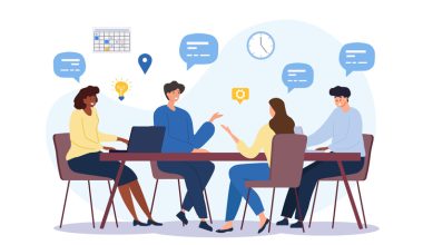Four people discussing at a table with icons like a calendar, light bulb, and laptop. There are comment bubbles in the space above them.