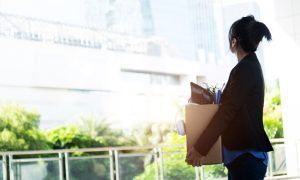 Unemployed woman leaving office building