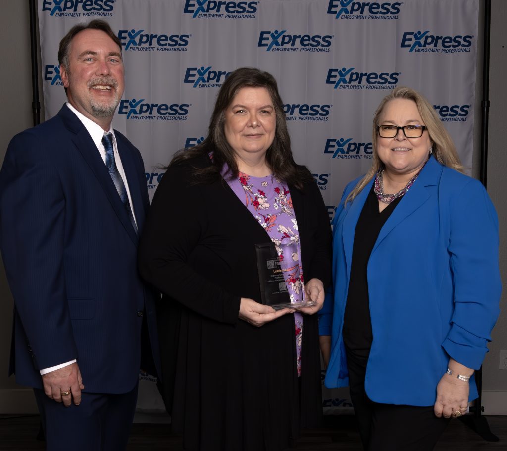 Three individuals standing in front of a backdrop featuring the Express Employment Professionals logo. The person in the center is Lennie Gray holding an ASA National Staffing All-Star award. 