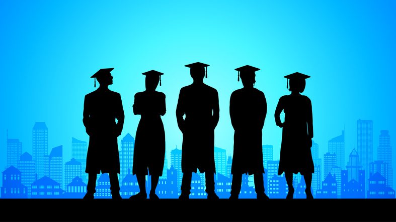 Graduates in the city silhouette.