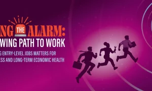 Illustration banner with purple and magenta gradient background, concentric target rings, and three silhouetted workers running toward a central goal. Text reads: “SOUNDING THE ALARM: THE NARROWING PATH TO WORK” and “WHY PROTECTING ENTRY-LEVEL JOBS MATTERS FOR WORKFORCE READINESS AND LONG-TERM ECONOMIC HEALTH.”