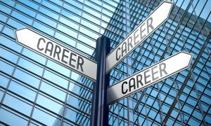 No Degree? High-Income Career Changes to Make Right Now. Career - crossroads sign, office building.